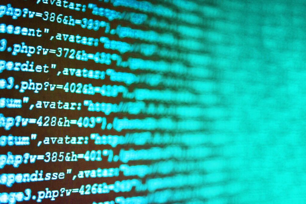 Desktop PC monitor photo. Data network hardware Concept. Softwar This image displays PHP coding for language, however, this image has a blurred effect.